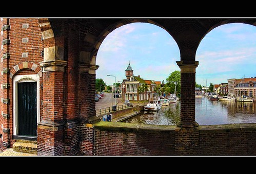 door city blue sky house holland tower water netherlands dutch stone architecture clouds river photography boat canal photo gate cityscape sony watertower stock nederland cybershot friesland fryslan watergate stockphoto sneek stockphotography snits wpk
