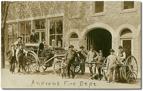 people usa man men history boys sepia kids buildings children hardware clothing andrews workmen hats indiana machinery firestation waterpump businesses wagons realphoto huntingtoncounty hoosierrecollections