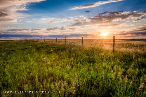 blue sunset sky sun west field grass clouds fence stars landscape evening wire post rays wyoming prairie plains barbed beams hdr naturesfinest anawesomeshot