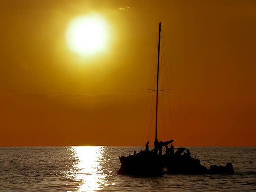 sunset reflection water sailboat boat costarica manuelantonio