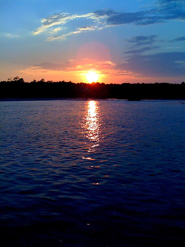 ocean light sunset sky sunlight beach water clouds northcarolina