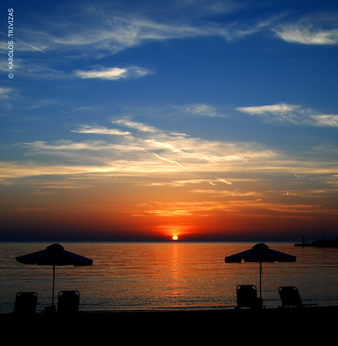 sunset sea sky sun beach clouds sand chairs greece molyvos beachumbrellas aegeansea gamps digitalcameraclub mithymna lesvosisland blinkagain
