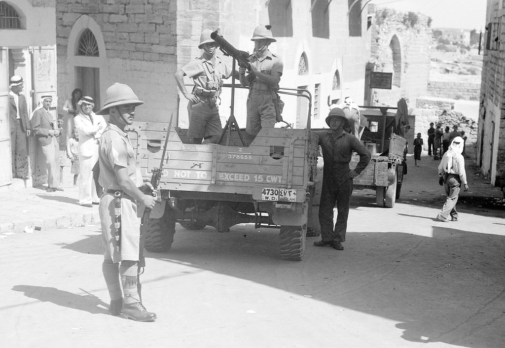 British soldiers from the 2nd Battalion Black Watch Regiment ( note nearest soldier wearing a Scottish Piper's ' Dirk '  ) in Bethlehem, Palestine - circa 1938