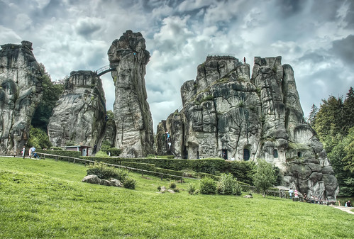 old sky cloud green grass rock clouds germany grey moss ancient ruins europe stormy pagan externsteine detmold