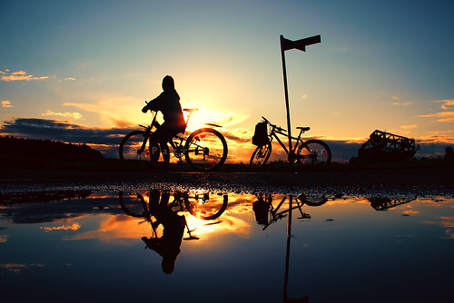 reflection bike puddle sundown
