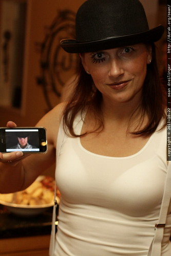 female droog displays a clockwork orange on her iPhone    MG 5539