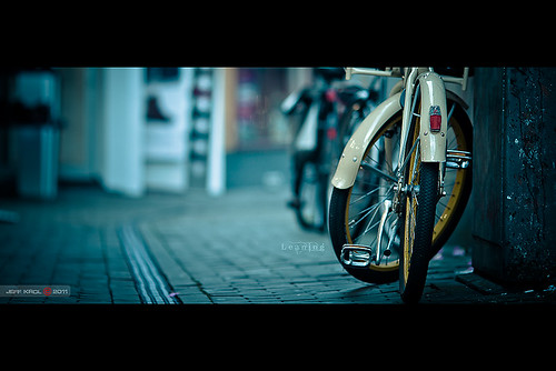 street city bike bicycle yellow wall canon eos alley low line tires f2 rims cinematic locked leaning zwolle 135mm 135l 60d canon60d ef135mmf2lusm jeffkrol