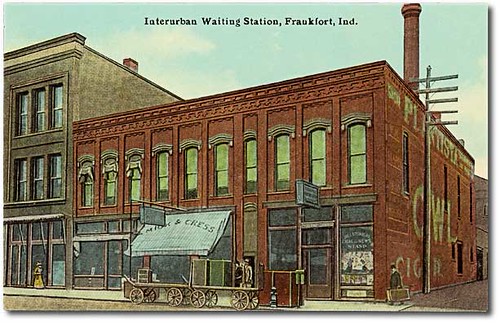 people woman usa signs man color men history industry station buildings walking advertising awning women indiana streetscene transportation shops pedestrians depot cigars storefronts interurban businesses frankfort clintoncounty hoosierrecollections