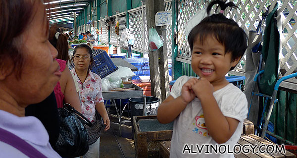 A happy little girl in the market