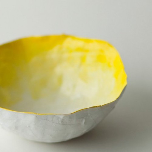 vivid yellow paper mache bowl