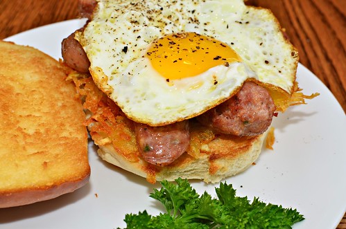Mmm... fried egg, sliced sausage, and hash browns on a grilled bun