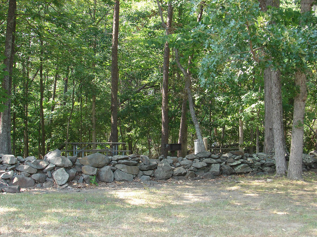 A stone fence stands as a reminder of the farm that was here before the park