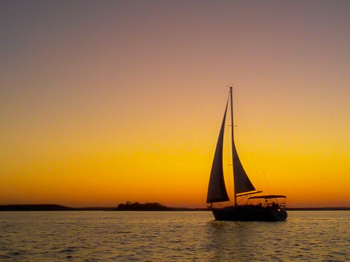 sunset summer orange water silhouette boat twilight waves texoma
